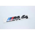 BMW M4 badge on a white background